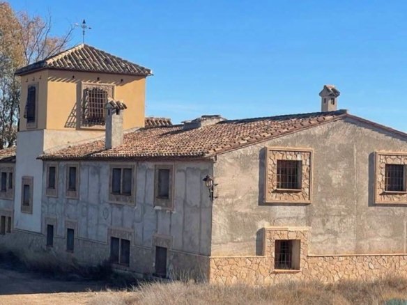 Facade with tower and stone window surrounds, Lorca estate