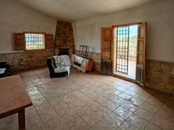 Living room with fireplace and balcony door, Lorca estate